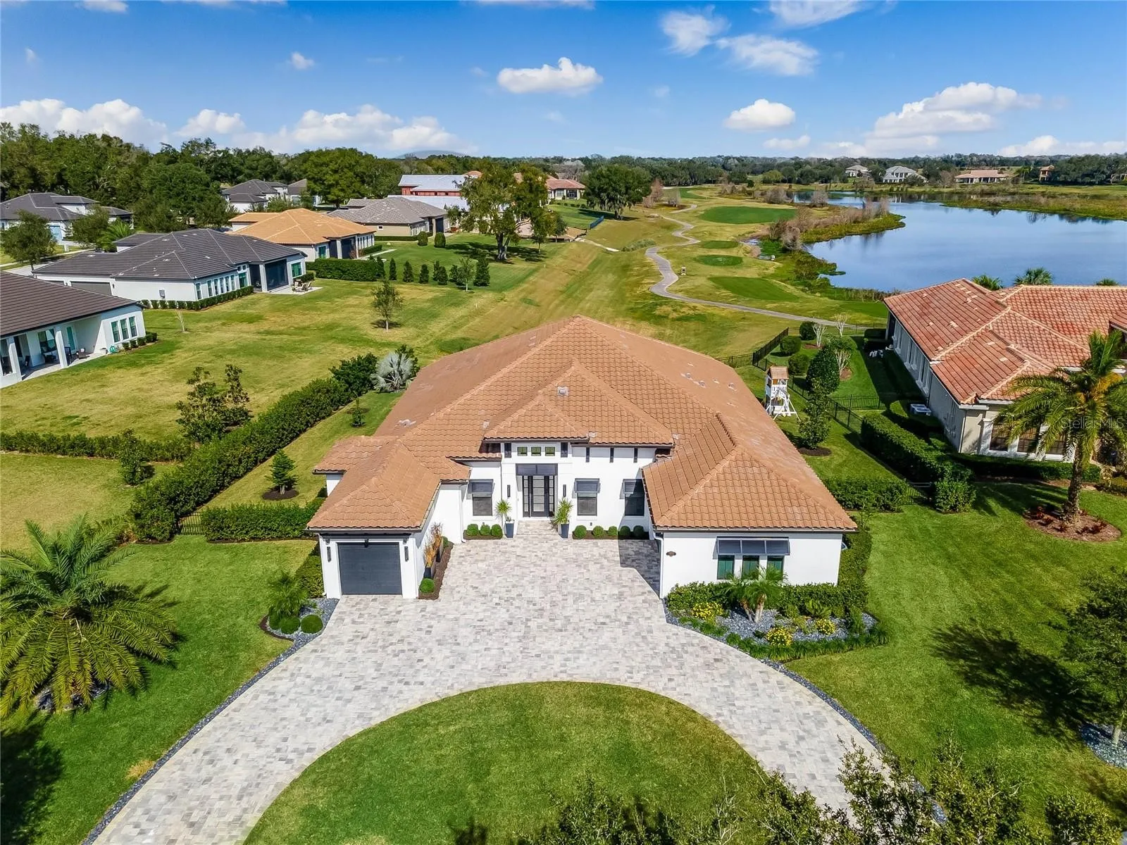 arial view of home with long driveway 